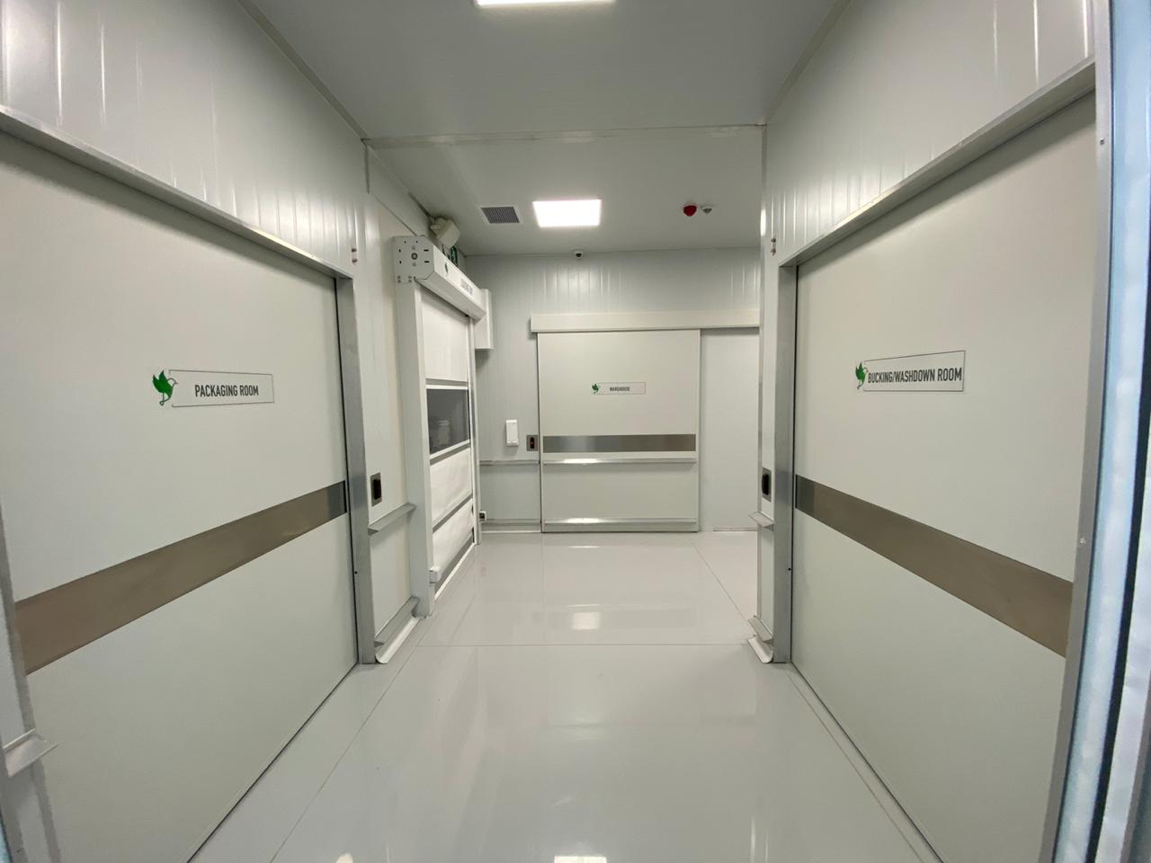 Cleanroom corridor between packaging and bucking/washdown rooms